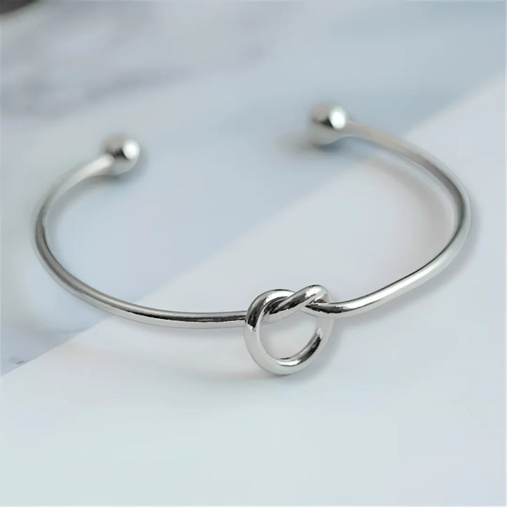 Gold bracelet with knot detail