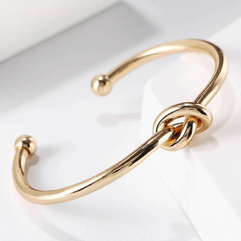 Gold bracelet with knot detail